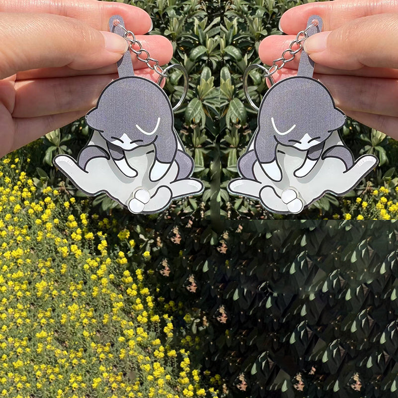 Playing with eggs and kitten keychain